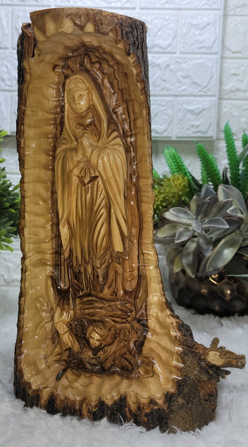 Guadalupe carved into Olive Wood branch