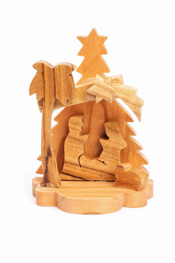 Olive Wood Nativity Scene_ Carved Grotto with Christmas Tree Background